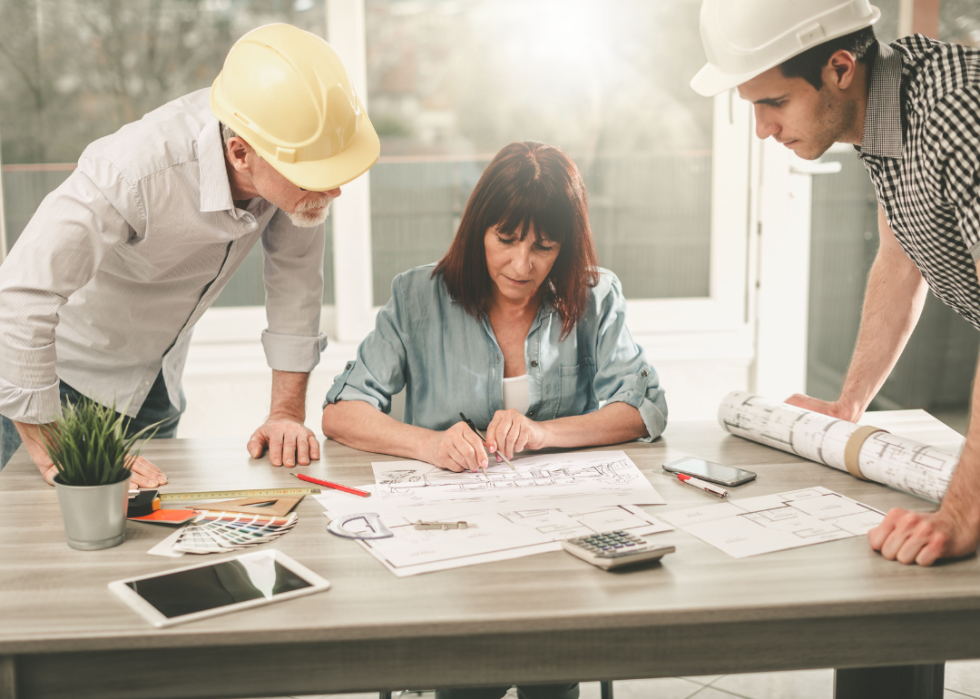 People going over architectural drawings.