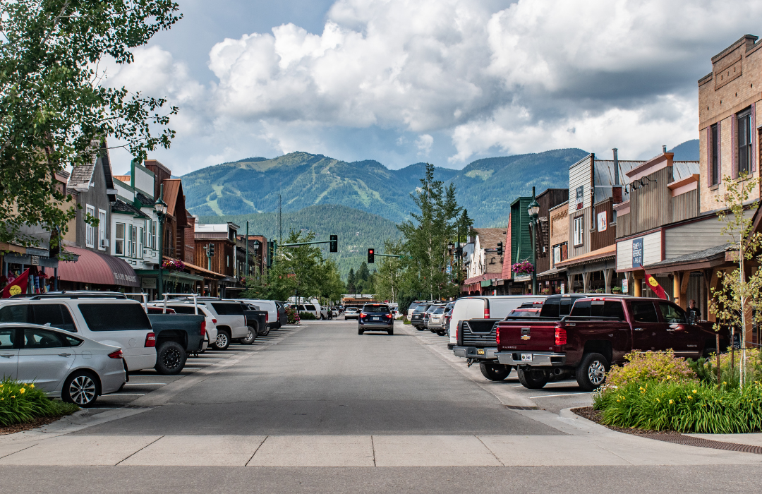 Cars parked along the road on Main Street in Whitefish, Montana.