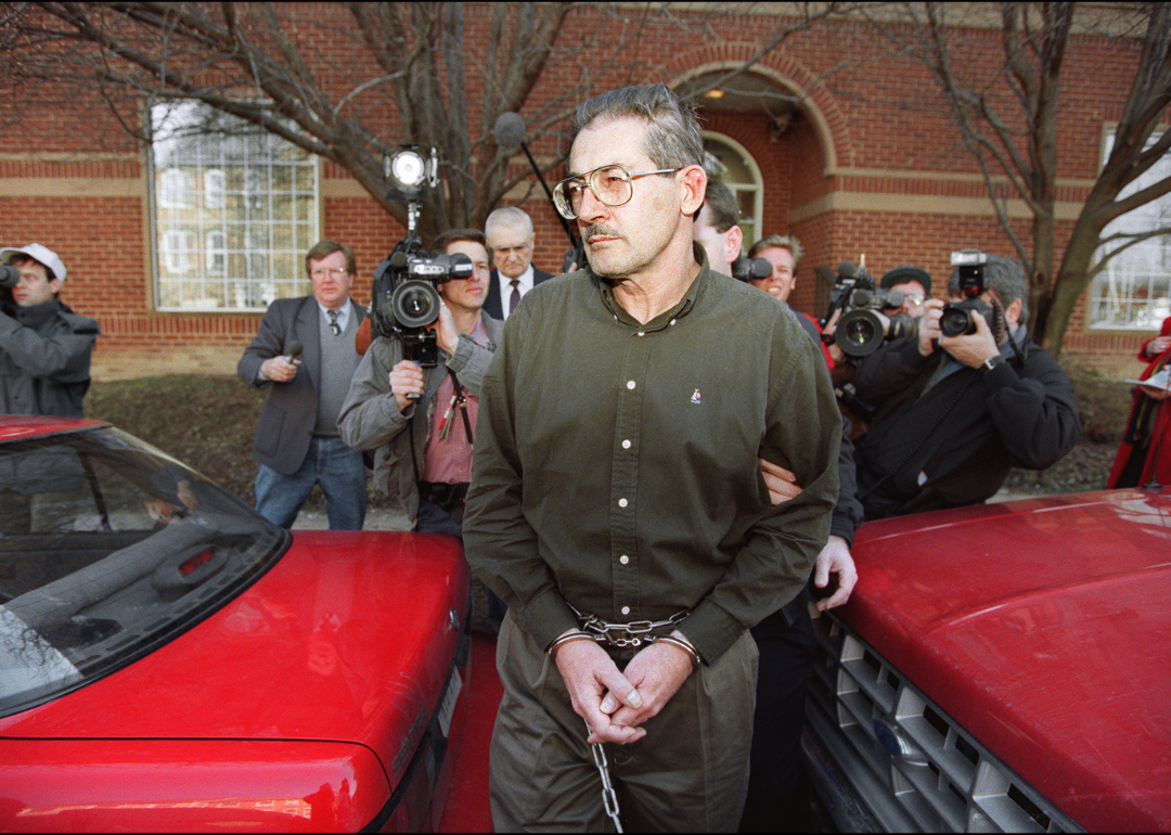 Former senior Central Intelligence Agency office Aldrich Hazen Ames being led from U.S. Federal Courthouse in Alexandria, 22 February 1994, after being arraigned on charges of spying for the former Soviet Union.