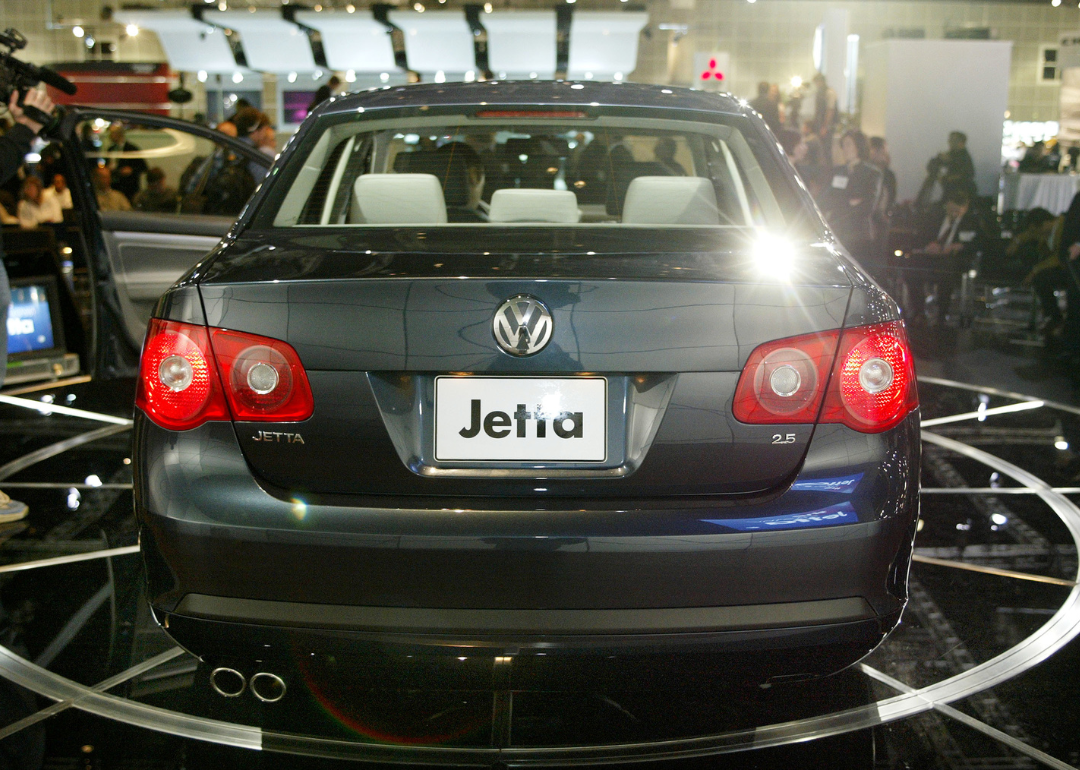 A Volkswagen Jetta on display at an auto show.