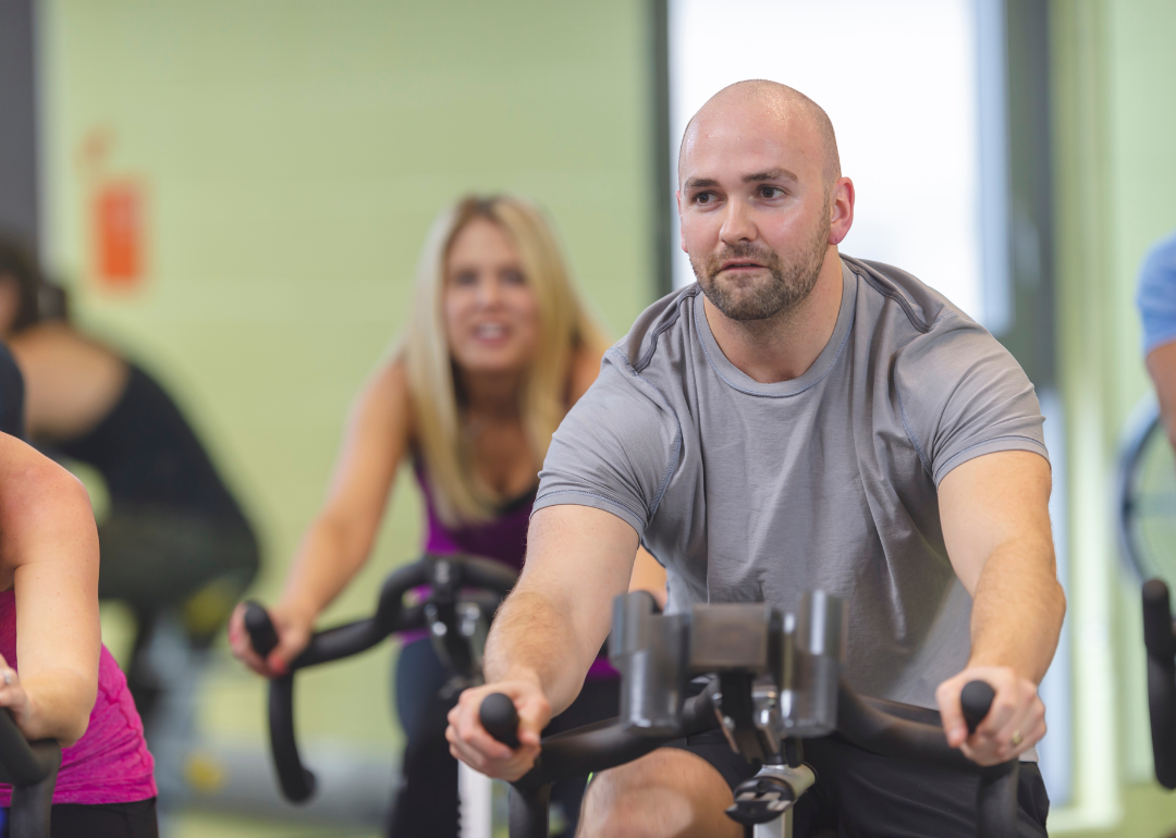 People exercising on stationary bikes