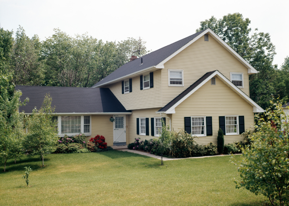 The exterior of a yellow house in 1986.