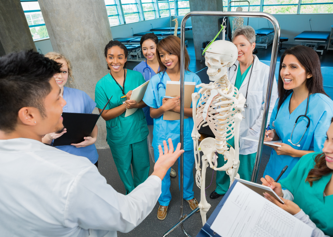 A college professor teaching an anatomy class to nursing students