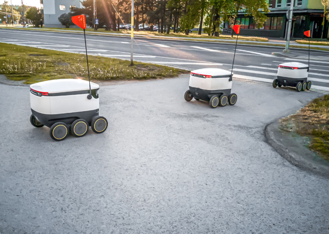 Delivery robots rolling down the street on the street.
