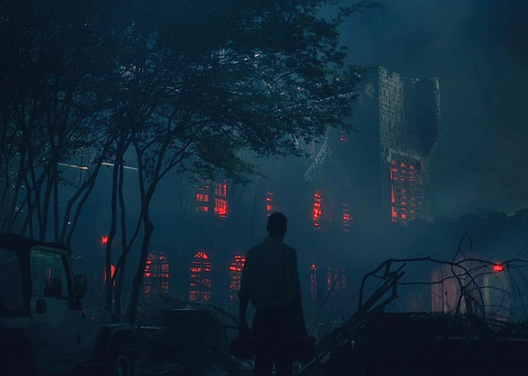 A glowing red house in The Haunting of Hill House