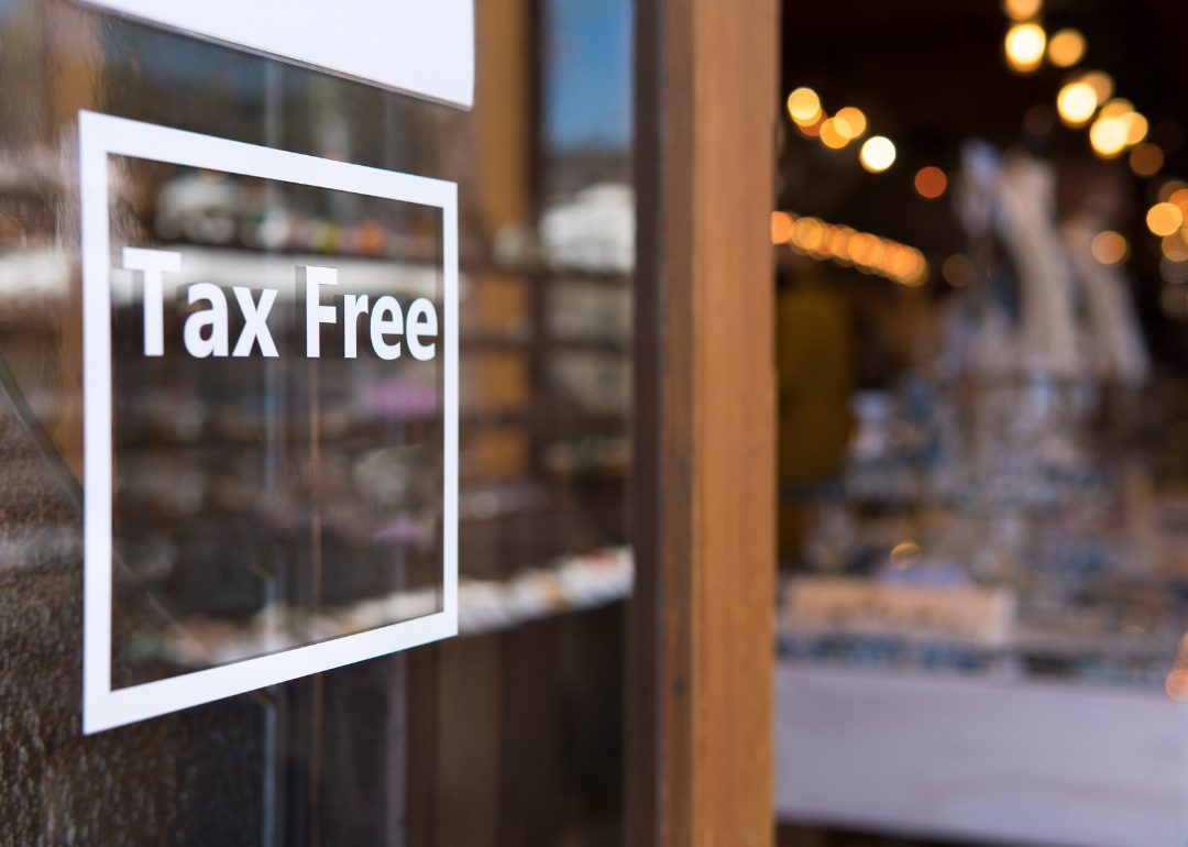 A sticker reading "Tax Free" outside a store.