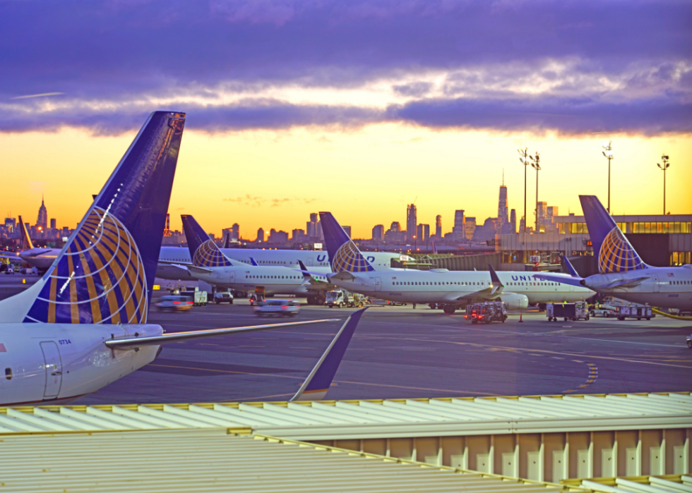 A dramatic sunrise view of planes at Newark Liberty International Airport 