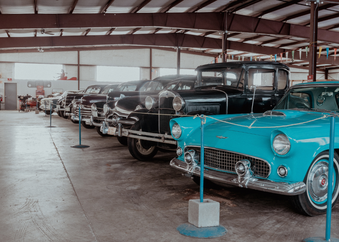 The inside of a hangar with retro cars in Bonanzaville USA museum in West Fargo.