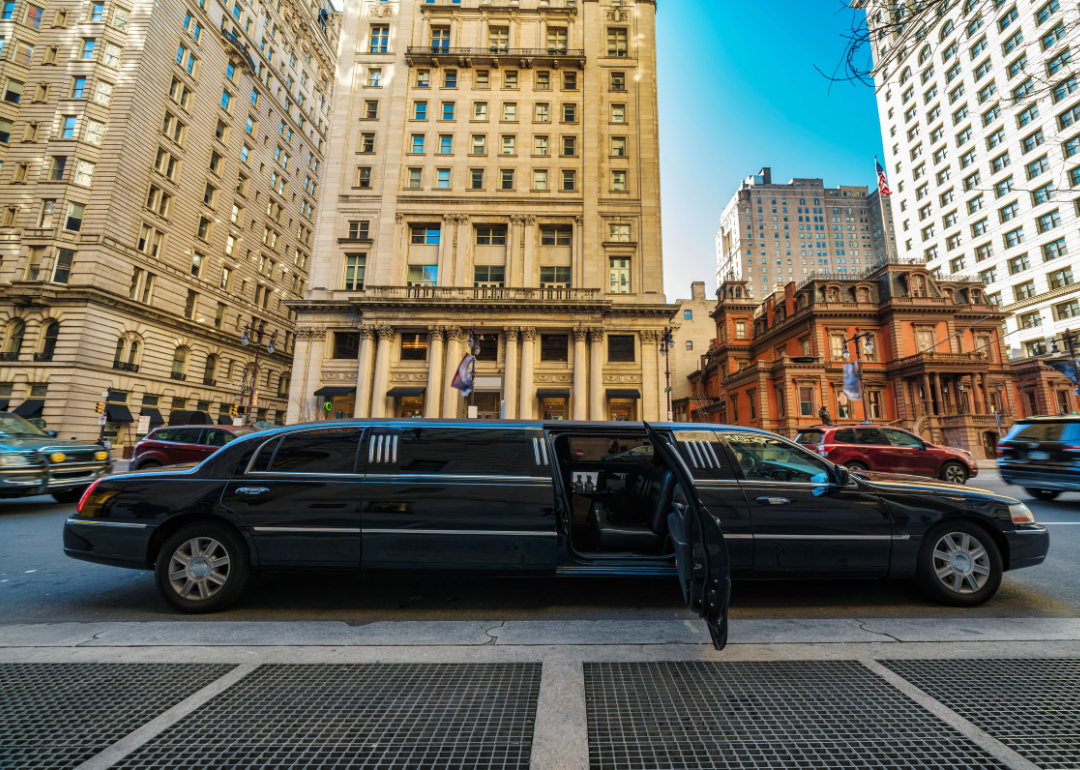 A luxury limousine with an open door in downtown Philadelphia.