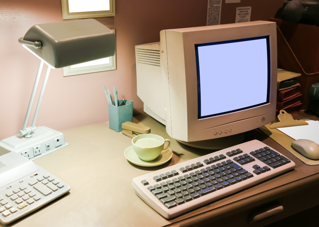 A computer from the 1990s on a desk.
