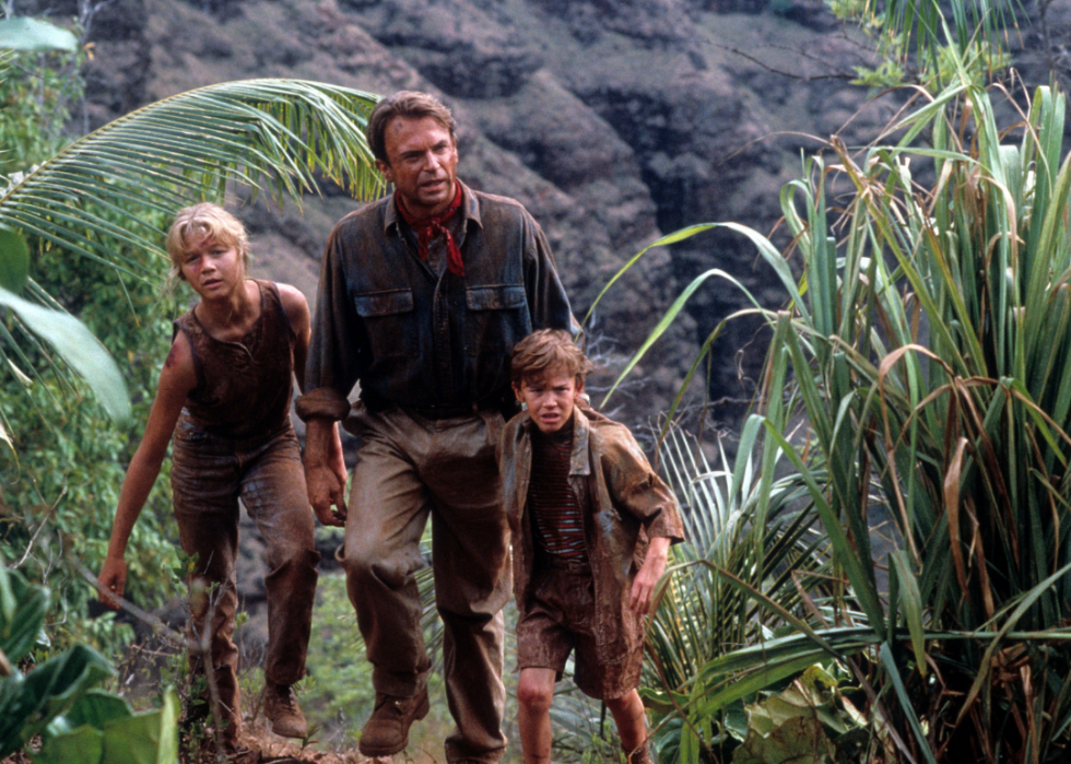 Lex (Ariana Richards) walks with Grant (Sam Neill) and Tim Murphy (Joseph Mazzello) at Jurassic Park