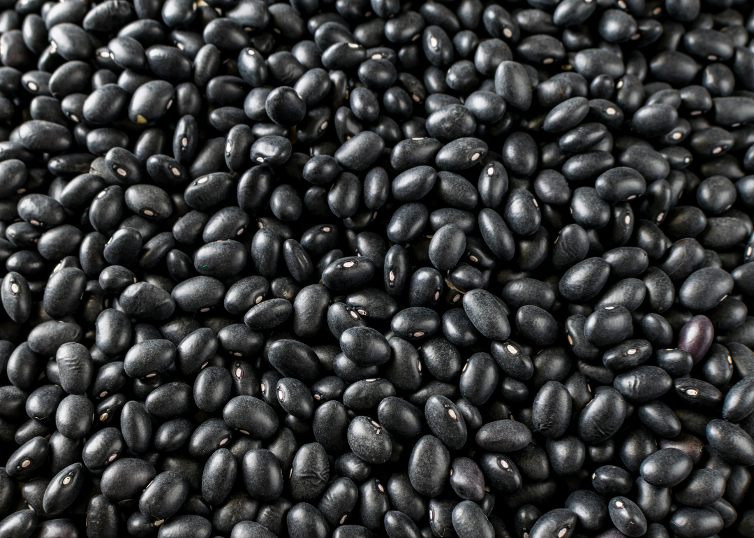 A close up of uncooked black beans.