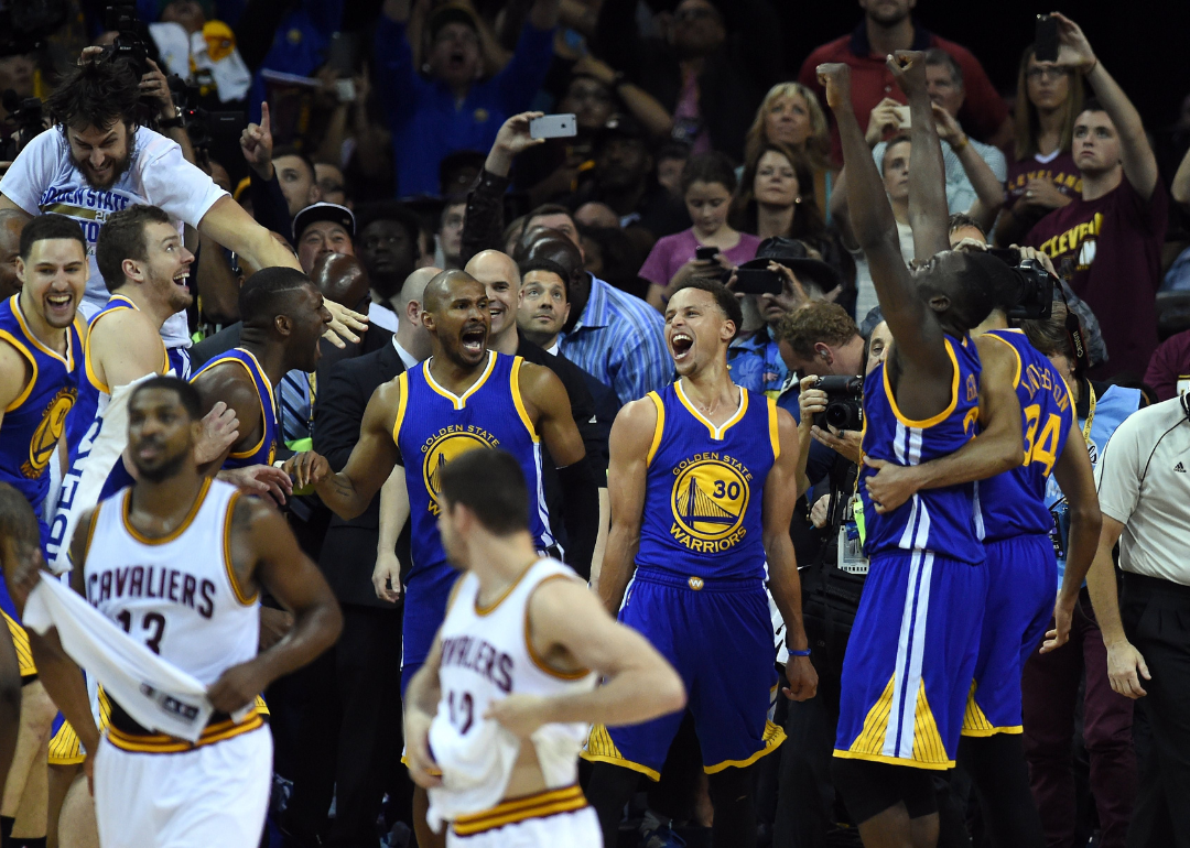 The Golden State Warriors celebrate defeating Cleveland in Game sSx to win the 2015 NBA Finals.