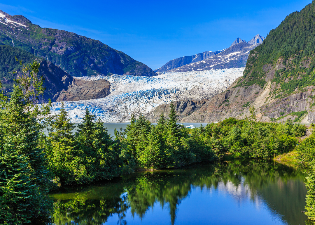 Mendenhall Glacier in Juneau with a reflection of the scenery in the lake.