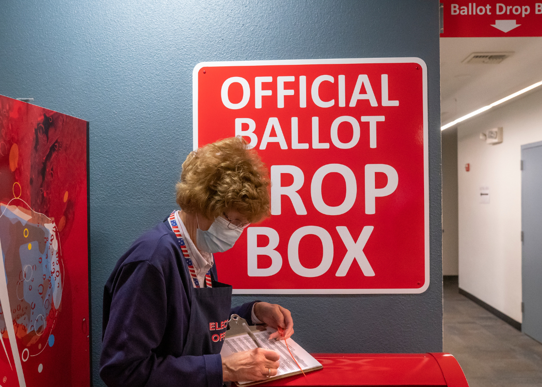 An election worker making a record of a ballot pickup in Vancouver, Washington