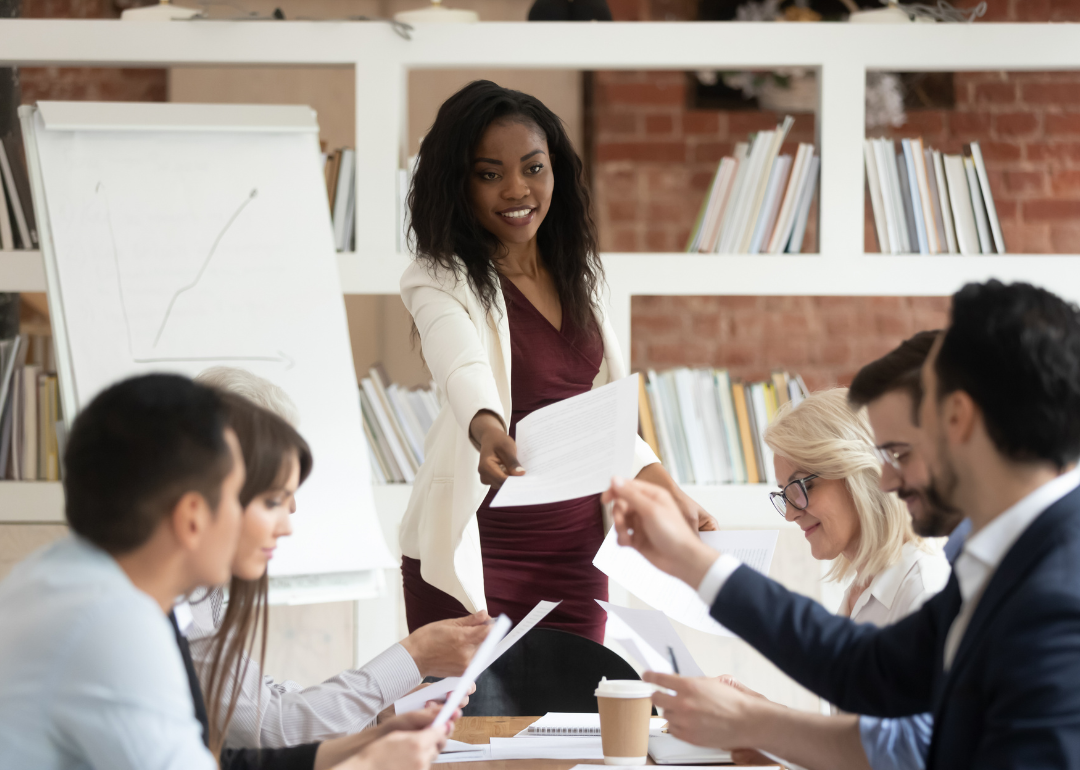 A business leader delegating to their team