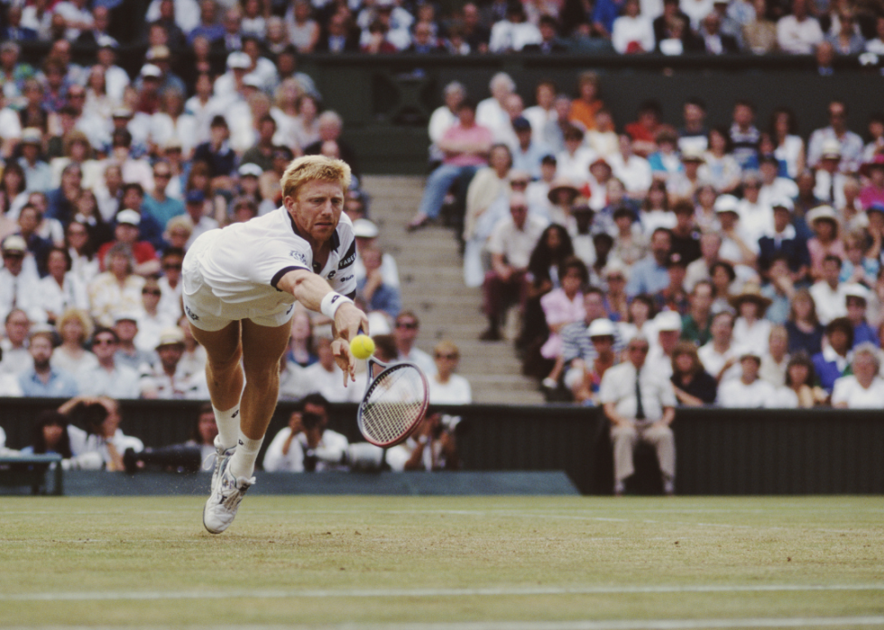 Boris Becker of Germany diving to make a return during the Men's Singles semifinal of the Wimbledon Lawn Tennis Championship against Goran Ivanisevic on July 1, 1994