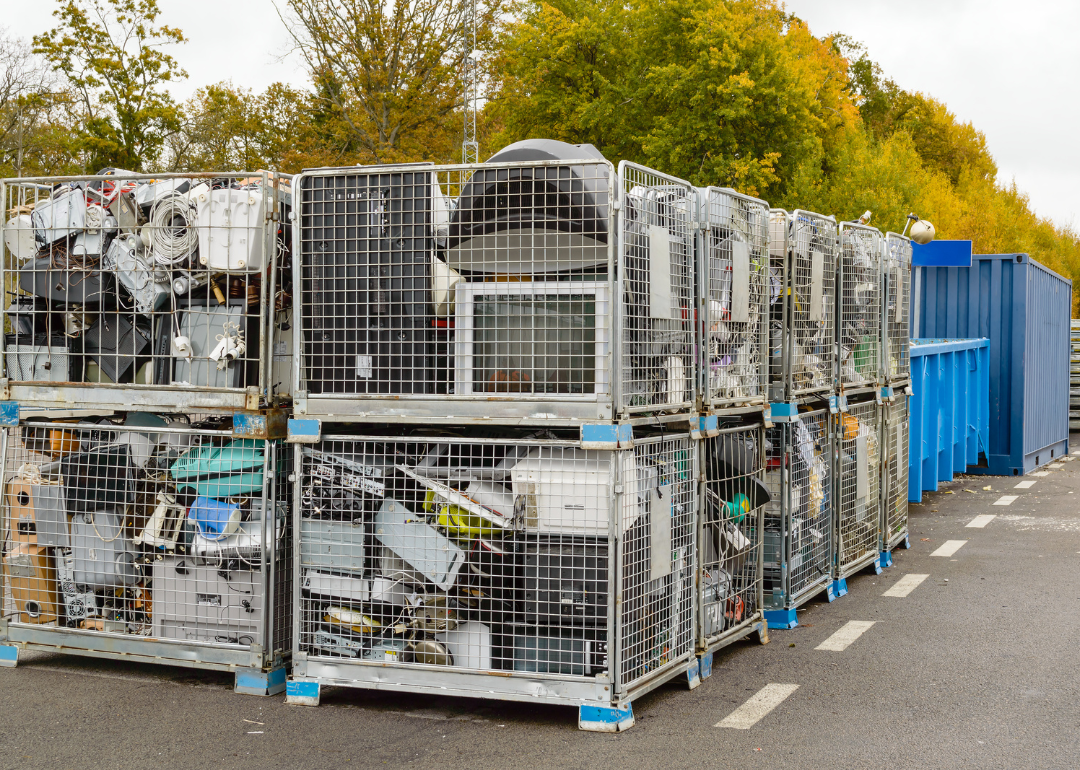 Netted bins full of discarded electronics waste waiting to be transported to the recycle plant for further processing