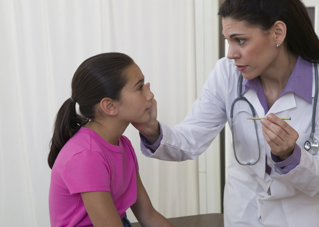A school nurse examining a student/patient