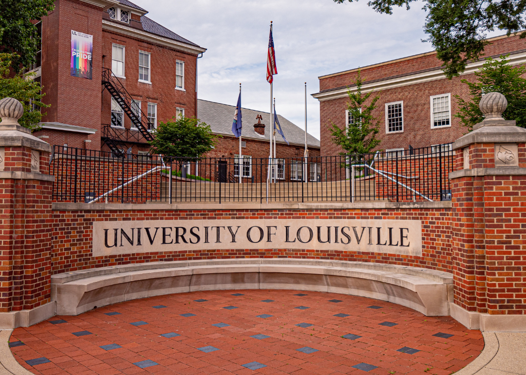 A brick University of Louisville sign