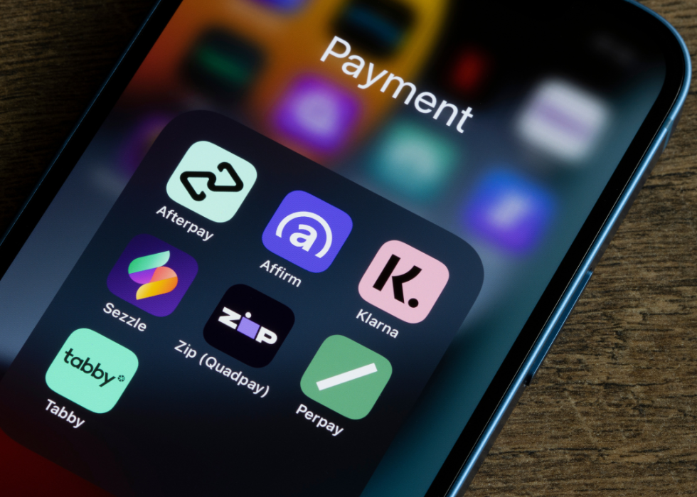 Assorted payment apps offering buy now pay later services are seen on an iPhone, including Afterpay, Affirm, Klarna, Sezzle, Zip (Quadpay), Perpay, and Tabby.