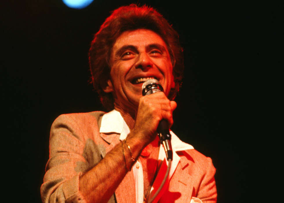 Frankie Valli performs onstage in the 1970s.
