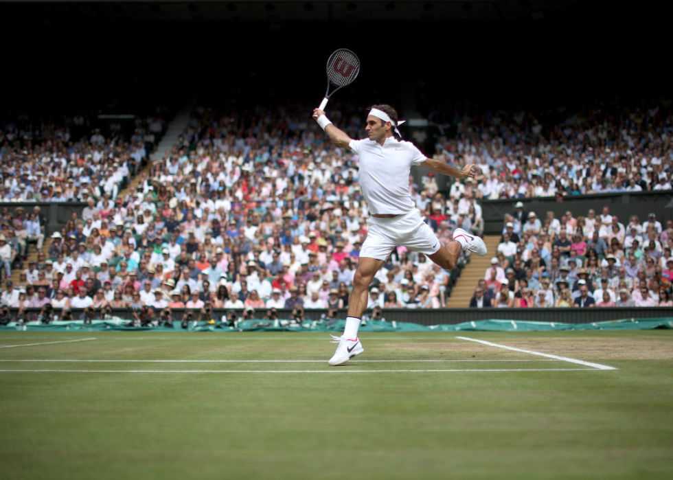Roger Federer of Switzerland in action against Marin Cilic of Croatia during the Gentlemen's Singles final of the Wimbledon Lawn Tennis Championships