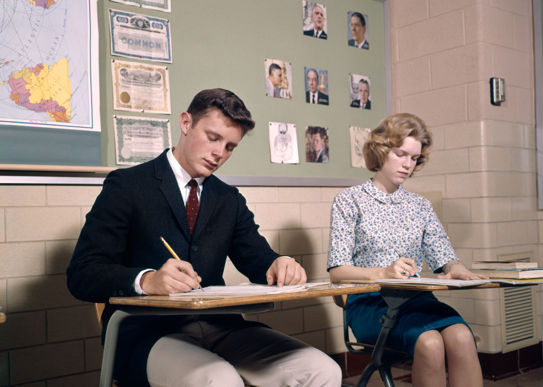 Two high schoolers taking an exam in the 1960s.