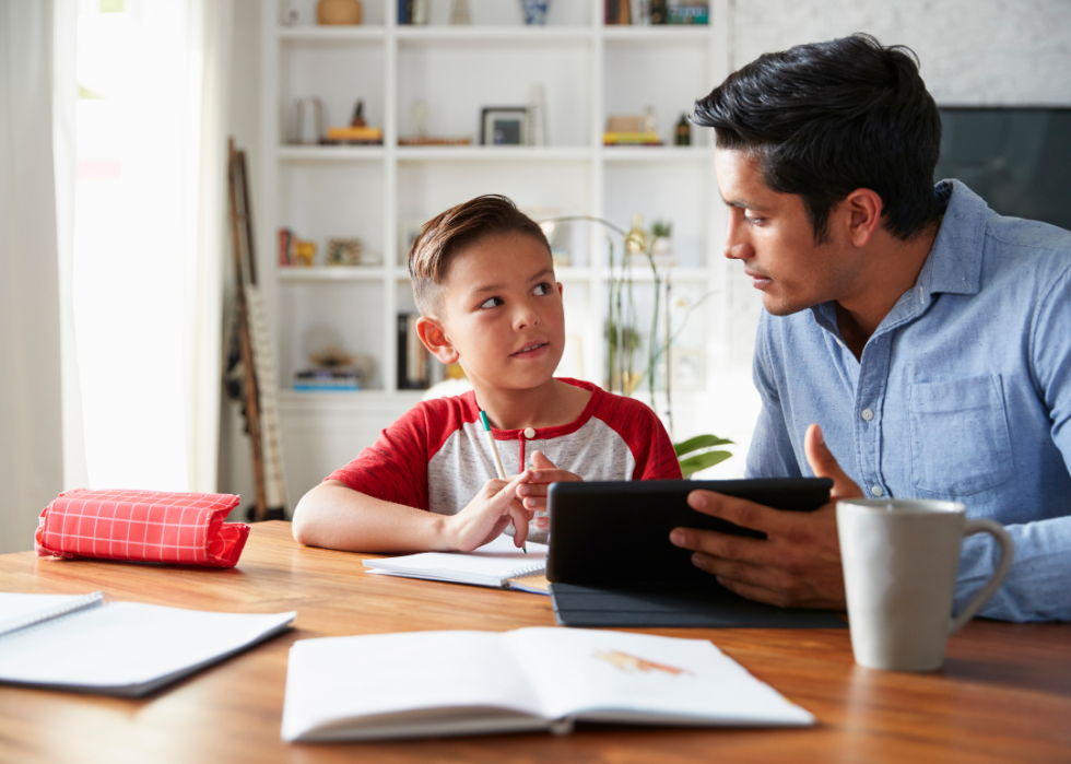 A father helping his son with homework