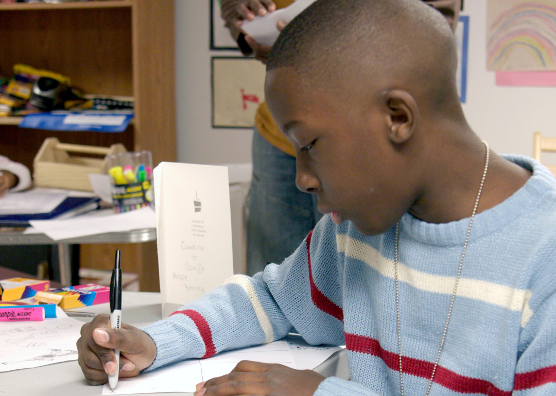 A Black student working on an assignment.