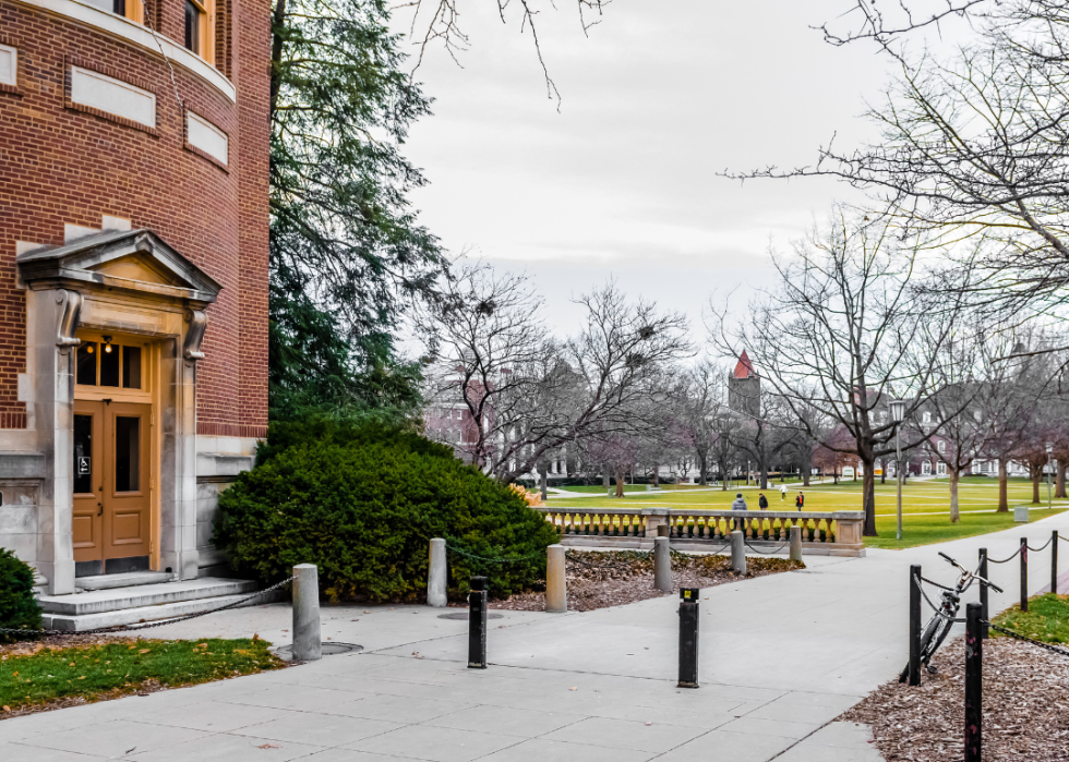 An exterior view of the campus of the University of Illinois Urbana-Champaign with the bell tower in the distance.