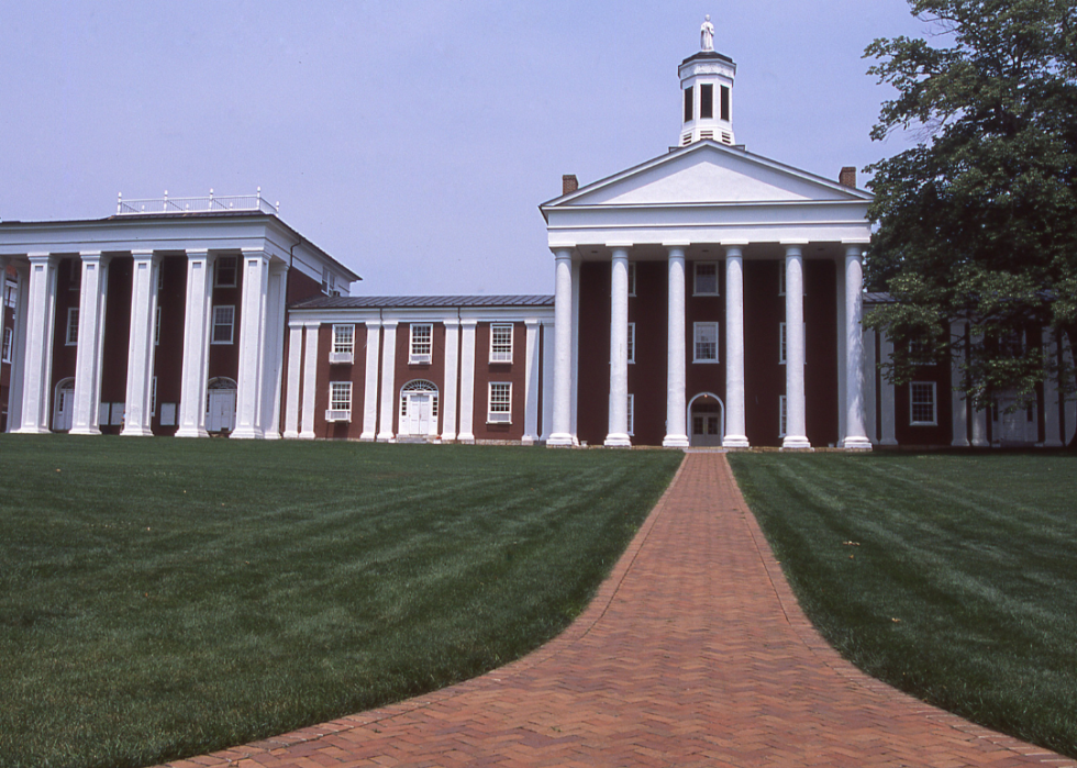 White pillars contrast with brick buildings on the campus of Washington and Lee University.