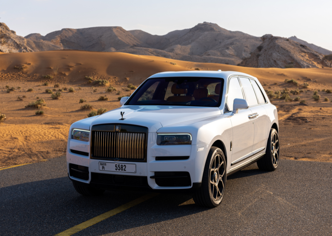 A Rolls-Royce Cullinan in a desert in Dubai.