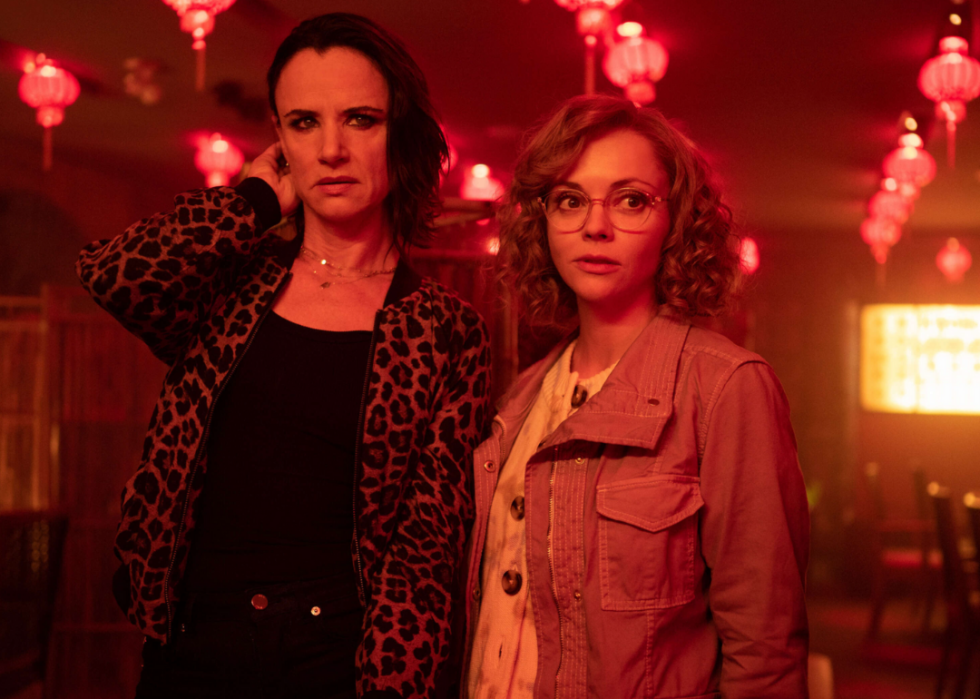 Misty (Christina Ricci) and Natalie (Juliette Lewis) standing together in an empty restaurant bathed in red light