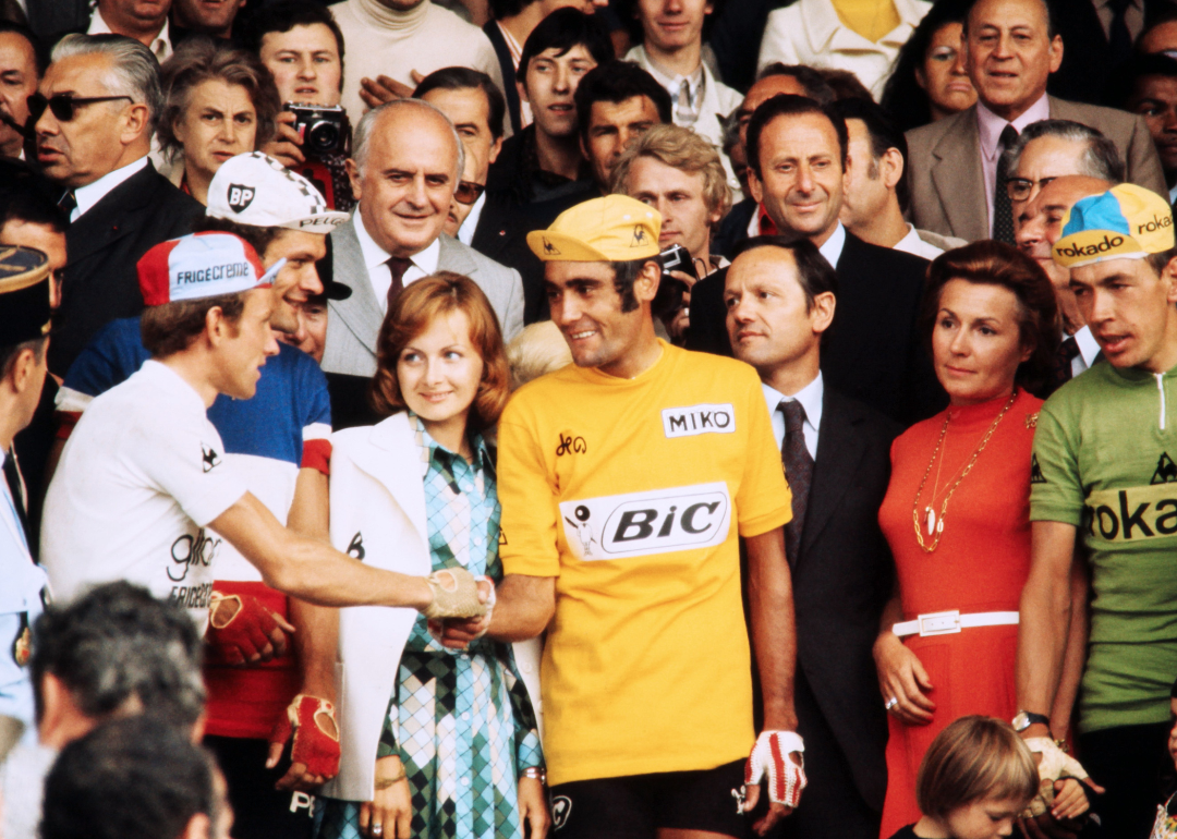 Spanish cyclist Luis Ocana shaking hands with other competitors, Herman Van Springel and Bernard Thévenet in Paris, on July 22, 1973.