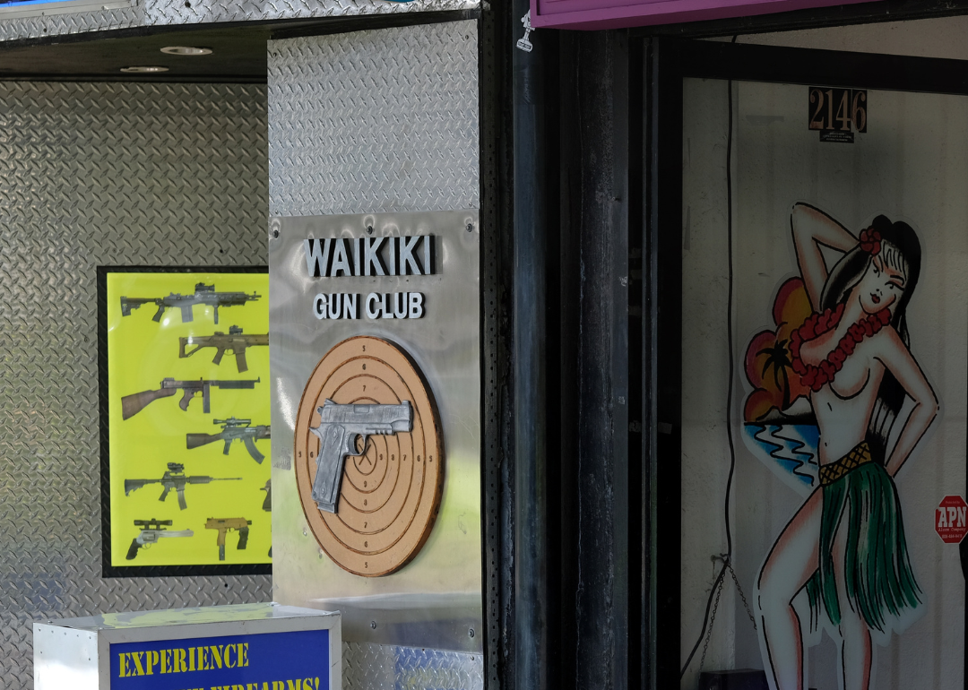 A gun club and a tattoo shop in Waikiki.