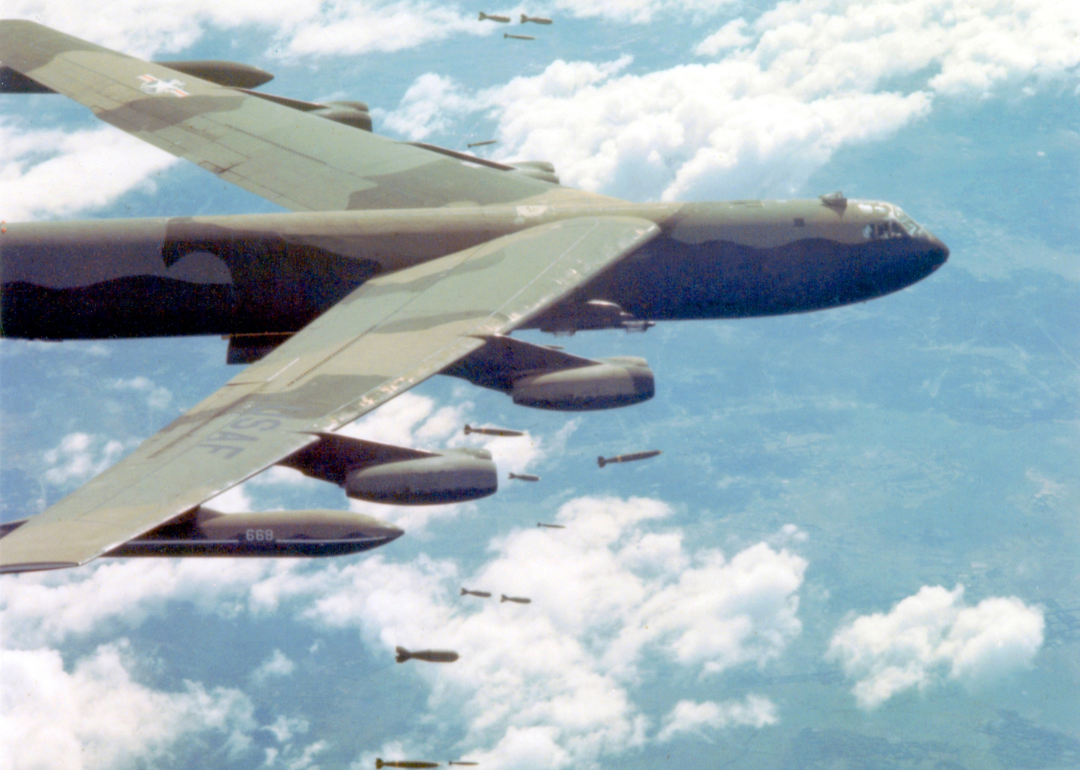 A U.S. Air Force Boeing B-52 Stratofortress dropping bombs over Vietnam.