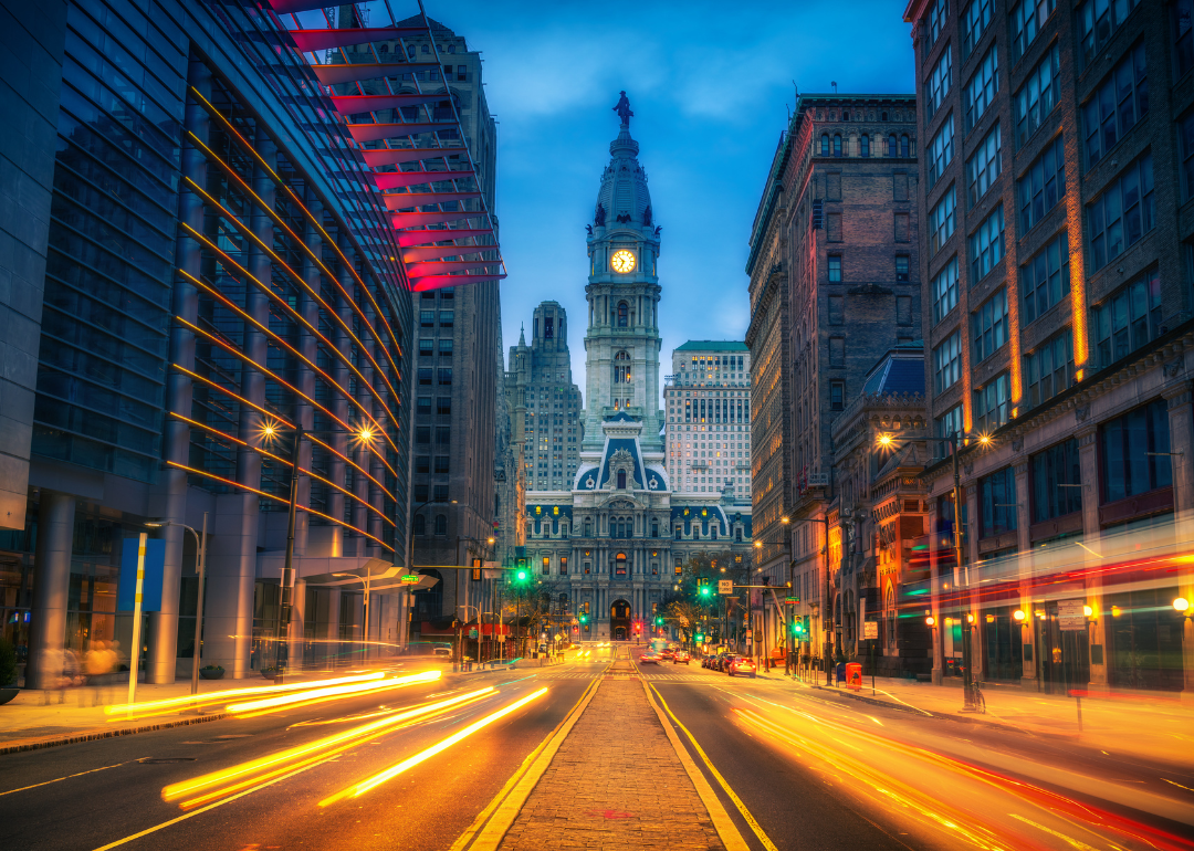 A street-level view of Philadelphia's City Hall at dusk.