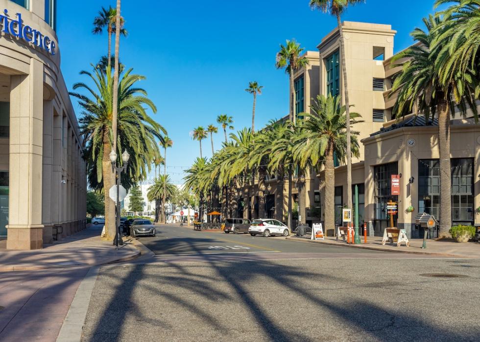 Buildings and palm trees on Center Street Promenade in the downtown area of Anaheim, California.