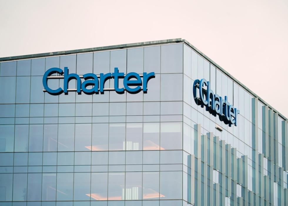 Corporate Headquarters of Spectrum Cable parent company Charter Communications offices and logo in Connecticut at sunset.