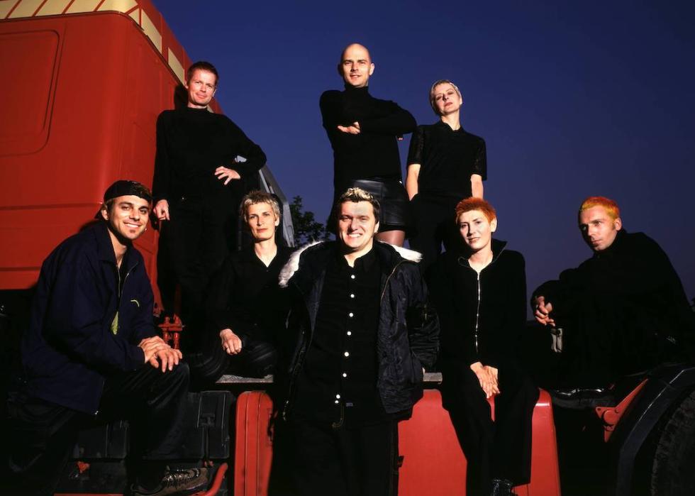 Chumbawamba, all dressed in black, in a portrait taken in the '90s.