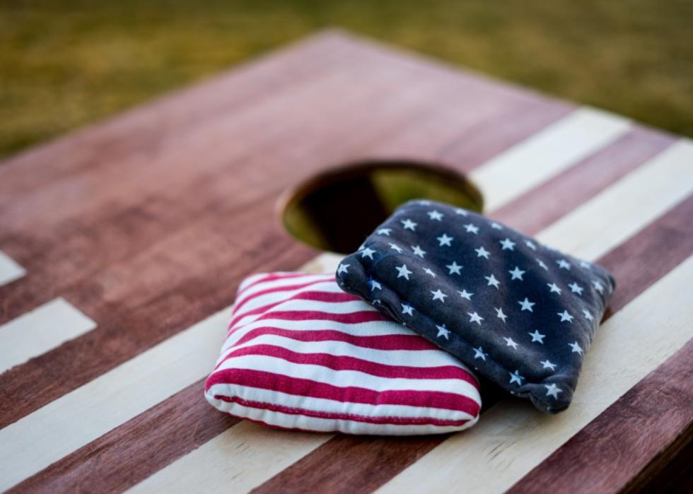 A red, white and blue cornhole game.