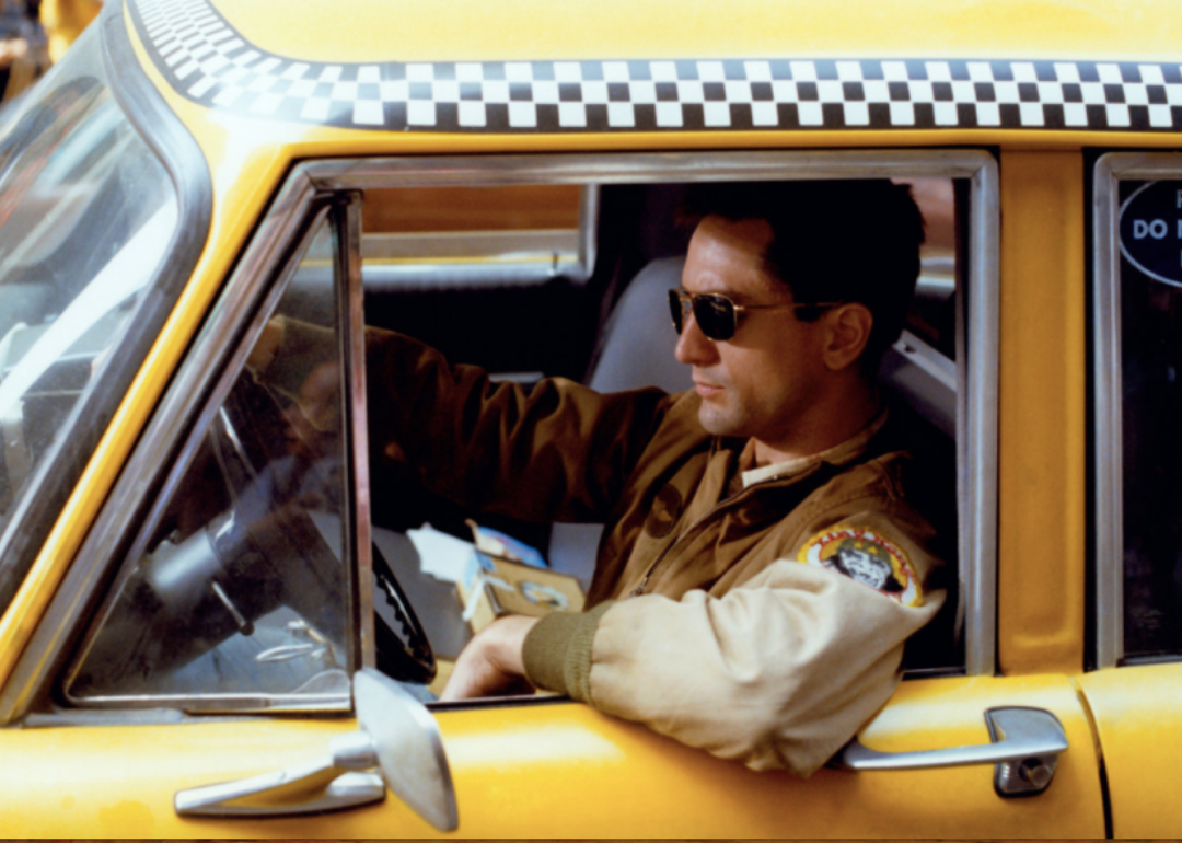 Robert De Niro driving a taxi.