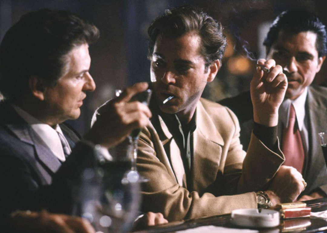 Ray Liota and Joe Pesci smoking at a bar.