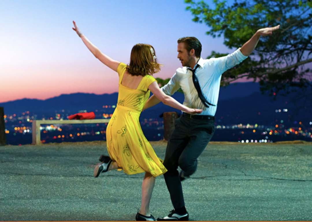 Ryan Gosling and Emma Stone dancing in the street.
