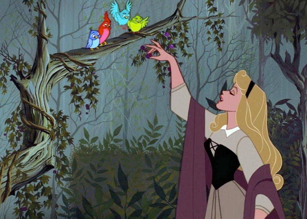 A cartoon of a woman talking to birds in a tree.