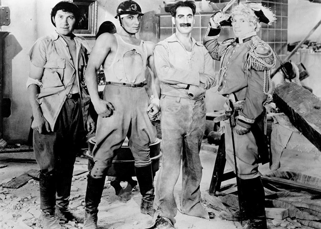 The Marx Brothers posing in tatters.
