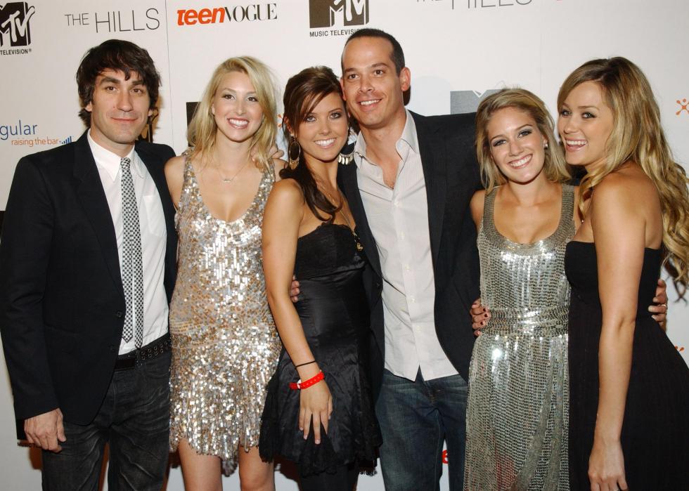 Cast of The Hills posing together at an event.