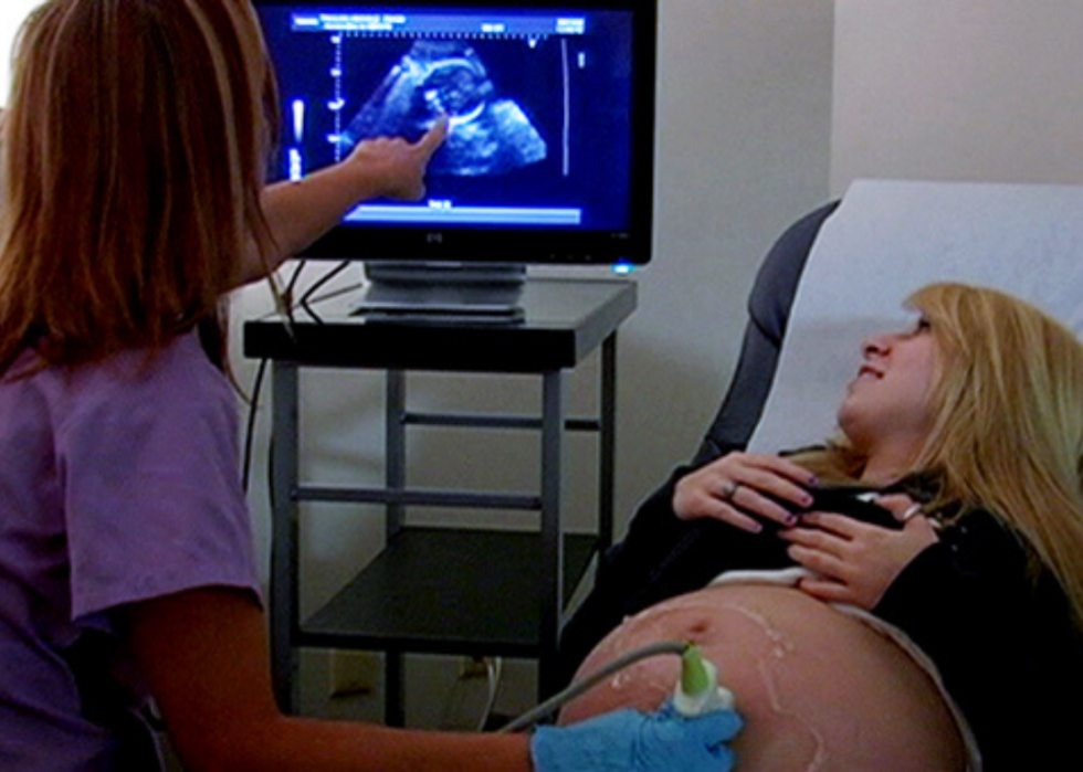 A woman gets an ultrasound.