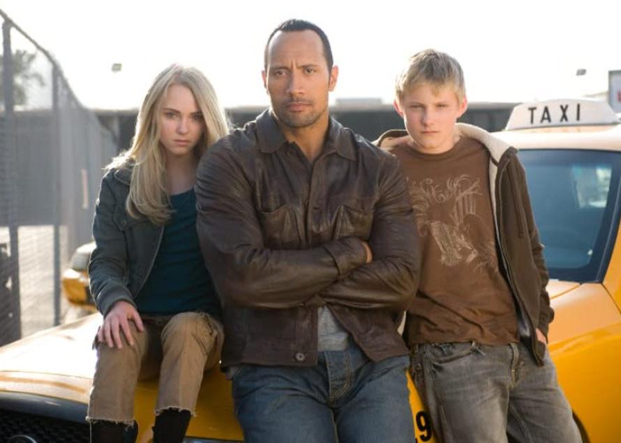 Dwayne Johnson, AnnaSophia Robb, and Alexander Ludwig in a scene from "Race to Witch Mountain"